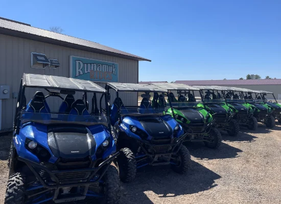 Row of side by side atvs in a parking lot