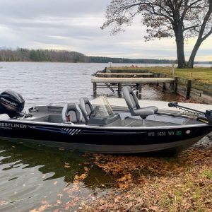 fishing boat at the dock on the lake